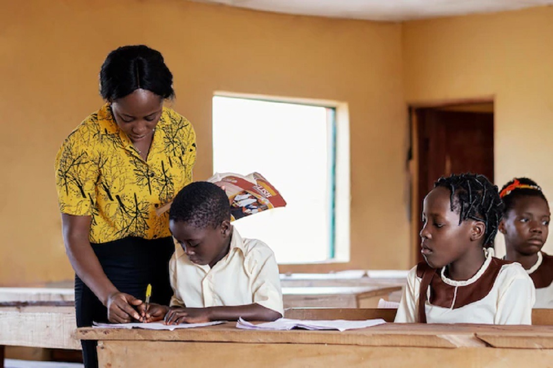 Woman teaching a child